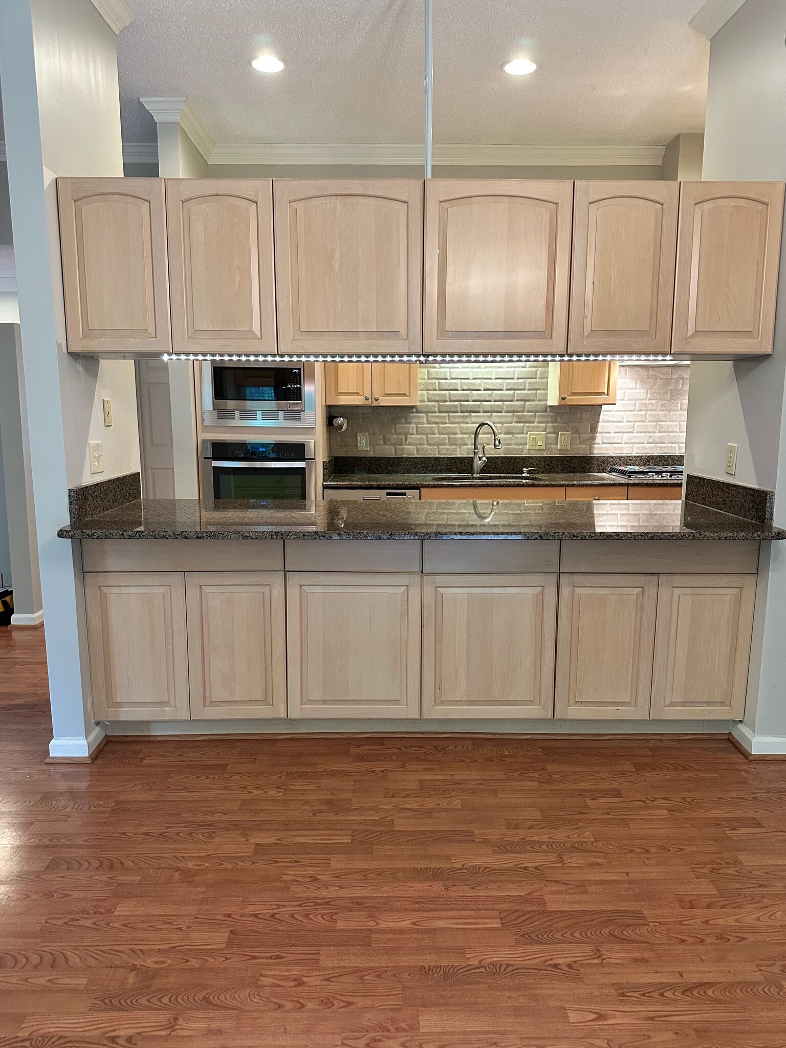 Kitchen open to dining room - 135 Brandeis Ln