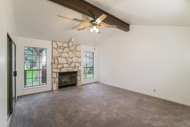 Building Photo - Charming 2-Bedroom Condo in Gated Community Surrounded by Mature Trees