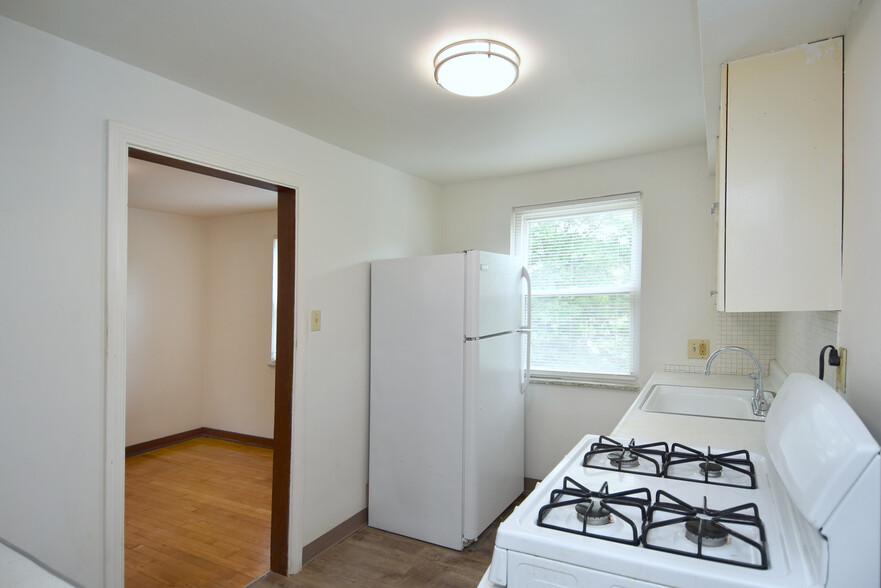 Kitchen with new luxury vinyl plank flooring and LED lighting - 210 E Garden Rd