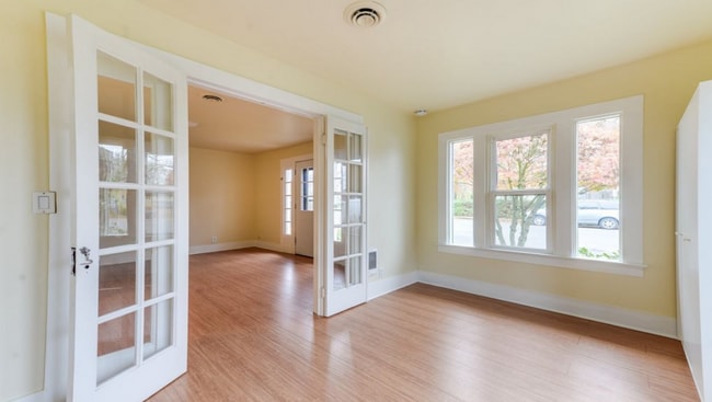 Building Photo - Charming 2 Bedroom 1 Bathroom Bungalow with Oversized 1 Car Garage and Large Manicured  Backyard ...