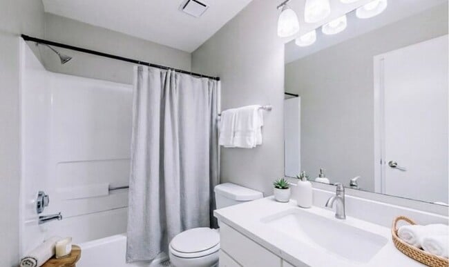 Building Photo - Spacious 2-Bedroom Elite Apartment with Private Balconies & Washer/Dryer