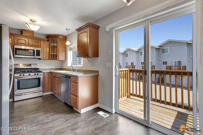 Kitchen w/ Door to Deck - 270 E 56th Ave