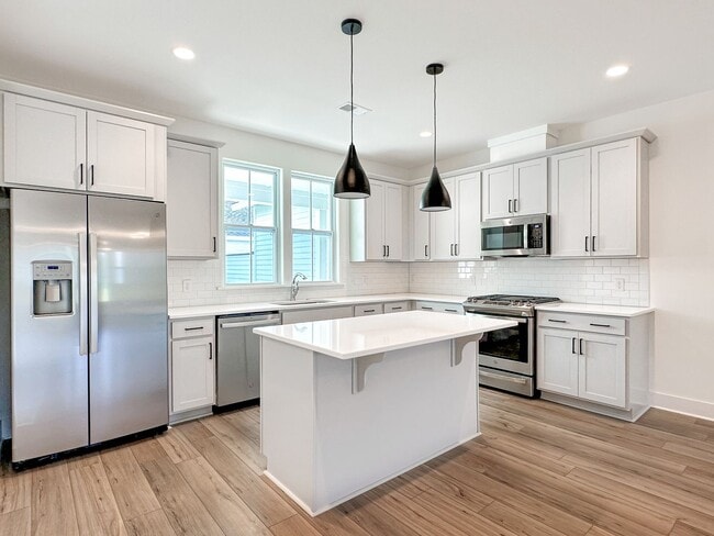 Building Photo - Beautiful, 3-Bedroom Midtown Nexton Townhome with Garage & Amenities