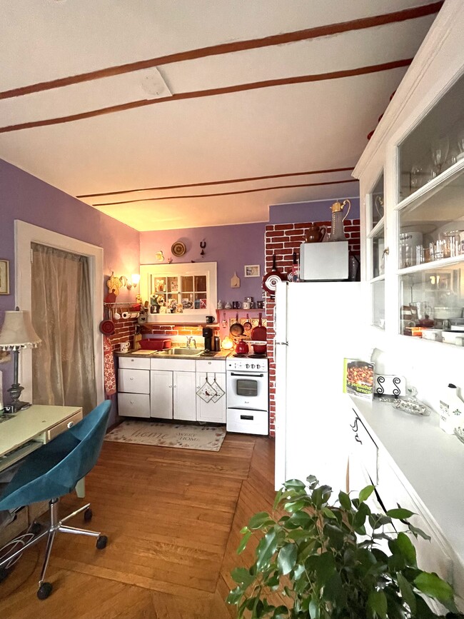Another view on adorable kitchen with cute window to hallway space and door going to living room - 42 Central Ave