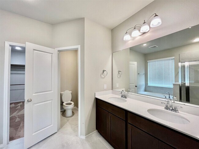 Building Photo - 8711 Windsong Trail Dr