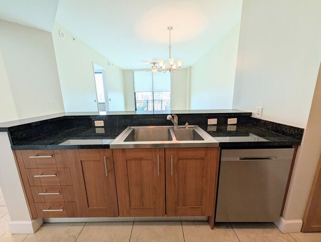 Building Photo - Modern 1BR/1BA Condo with 2 Parking Spaces – Prime Coral Gables Location