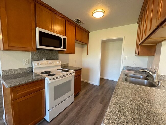 Building Photo - Centrally Located, Nicely Updated Throughout, Large Backyard, Attached Garage