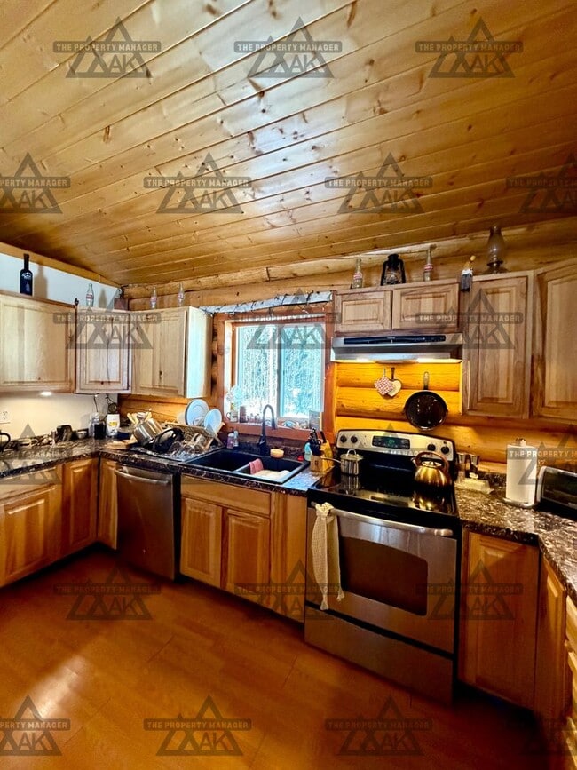 Building Photo - Charming Cabin – 2BR Home with Wood Stove - Dog Friendly