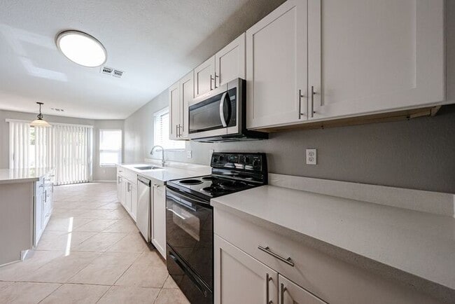 Building Photo - Introducing a stunning 4-bedroom, 2.5-bath...