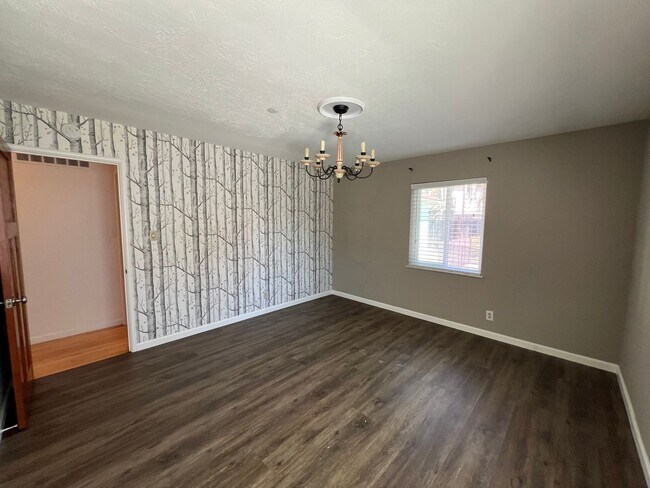Building Photo - Spacious 4-Bedroom Retreat Just Steps from...