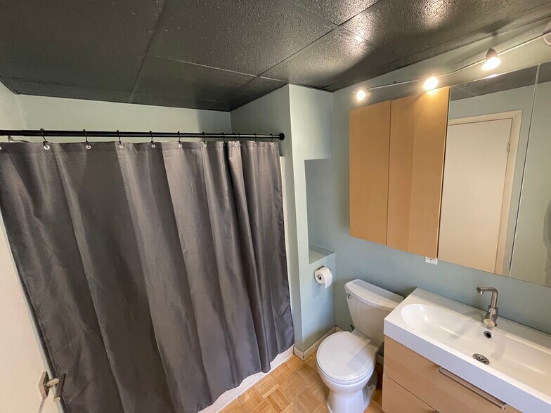 Bathroom has plenty of storage including a towel storage area - 227 Wilbert St