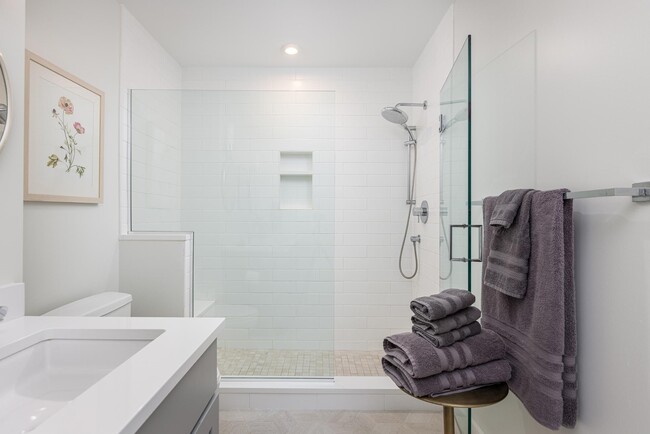 Ensuite master bath with large shower, heated floors. - 383 Commercial St