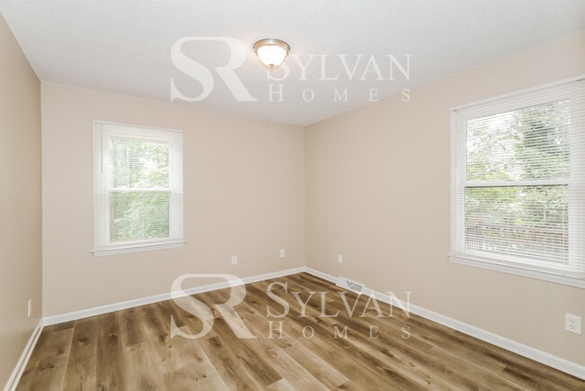 Building Photo - The living is easy in this 4 bedroom, 2 bathroom home