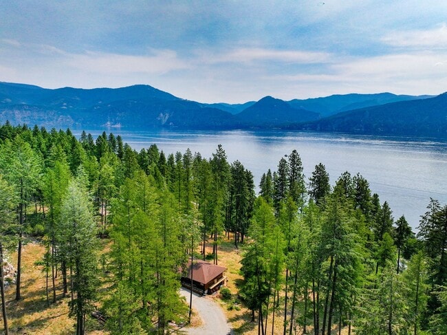Building Photo - 2700 + sq ft family home has it all! Over 2 acres of land and a stunning view of Lake Pend Oreille