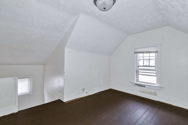 Building Photo - Charming 3BR Home with Classic Woodwork, Porch & Bonus Attic Space