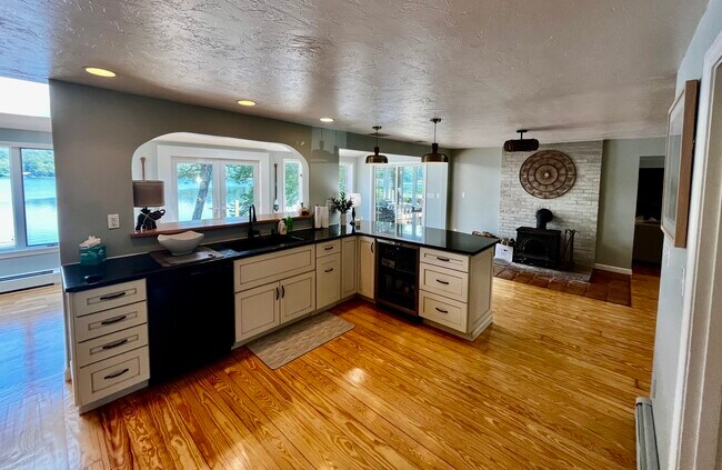 open kitchen into sun room - 56 Goldfinch Ln