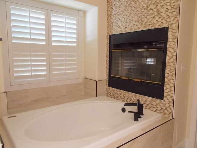 Building Photo - Charming Home in Gated Melrose Park Estates with Dual Fireplaces & Covered Patio
