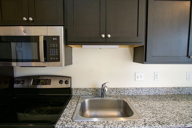 Building Photo - Corner 2 Bedroom with DW, W/D, Fireplace +...