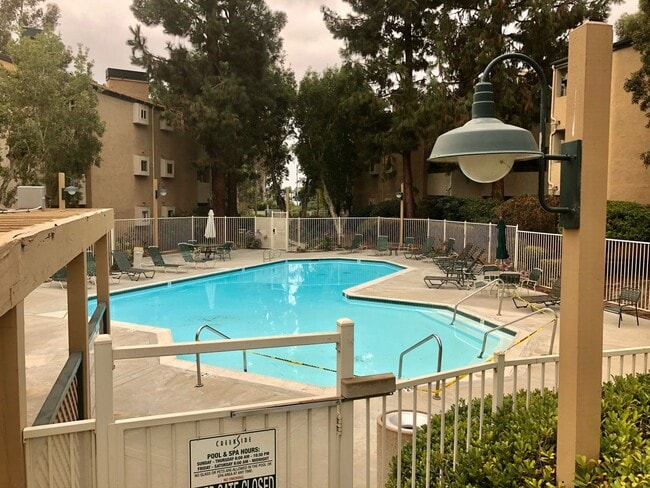 Building Photo - One Bedroom with Garage and IN-Unit laundry in Resort-Style Complex