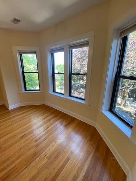 Beautiful bay windows facing tree lined street - 4056 N Harding Ave