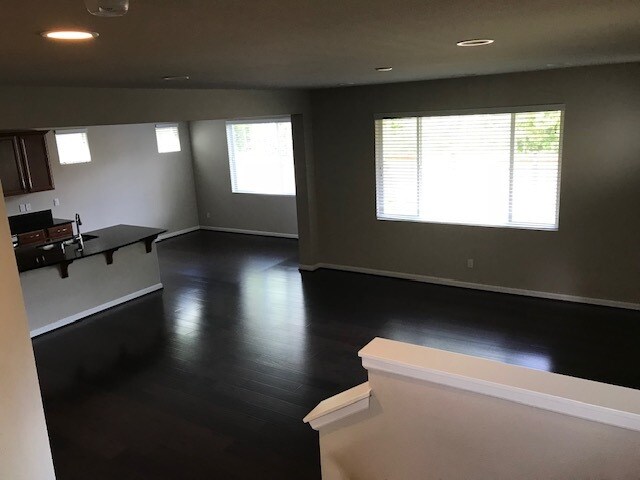 Living rm, kitchen & dining from stair landing - 8828 Jayden Ln NE