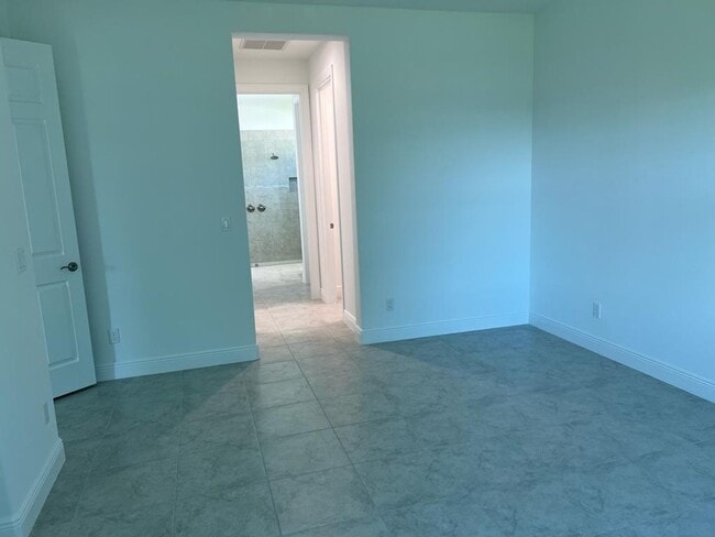 Building Photo - This Charming Brand-New Home is a 4/3 with...