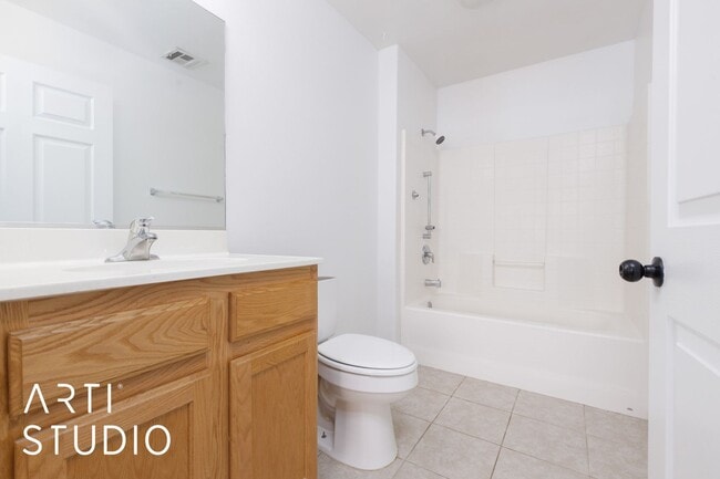 Building Photo - 3-bedroom 2-bathroom townhouse with a 1-ca...
