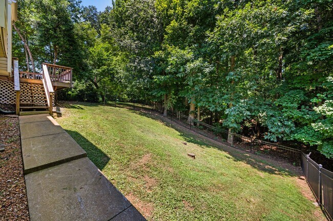 Building Photo - Stunning Stone Fireplace • Finished Basement • Fenced Yard
