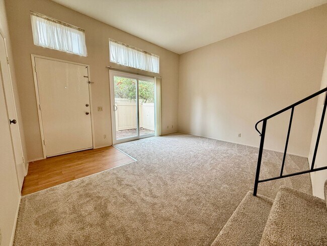 Building Photo - Move in Ready! 2BD Townhome! New Carpet! Two Patio Spaces! Attached Garage!