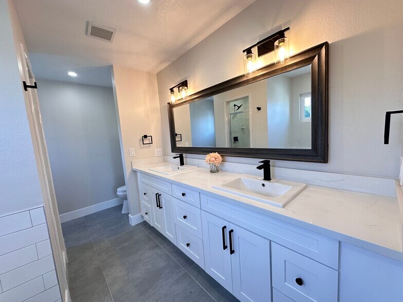 Primary Bedroom with double sink vanity - 770 W 2nd St