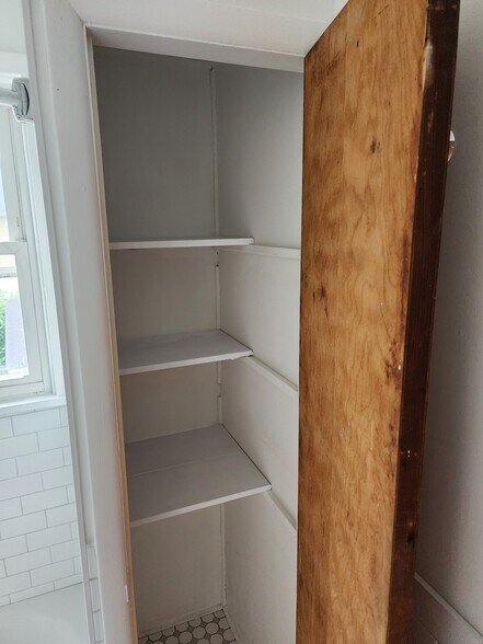 Linen closet in bathroom - 303 S 3rd Ave
