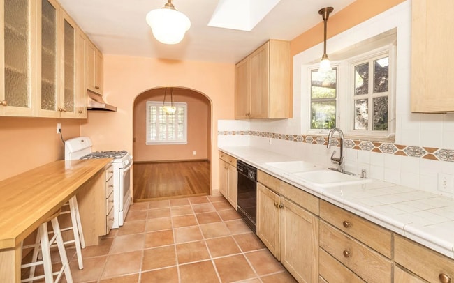 Building Photo - Charming Spanish Style Cottage with Incredible Deck- Gardener's Delight!