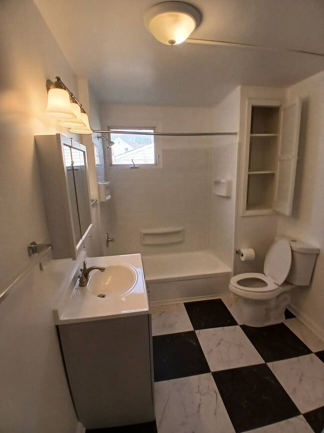 Building Photo - Newly Renovated 4BR/1BA Single-Family Home with Garage – Cleveland