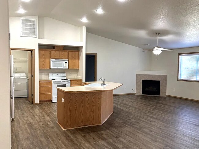 Building Photo - this ranch-style home features 4 bedrooms and 2 bathrooms.