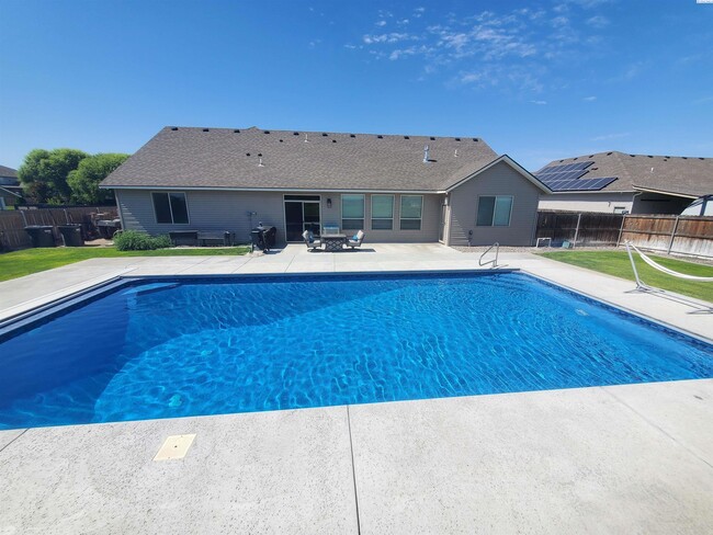 Building Photo - FOR RENT: West Pasco with heated inground ...