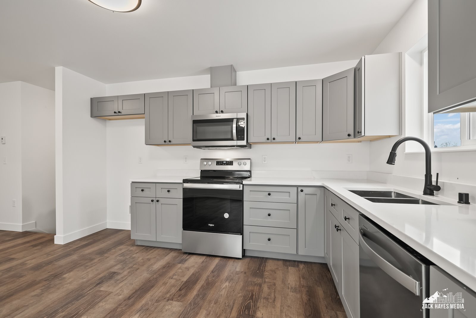 Actual unit has a SS fridge - 1493 W 40th Ave