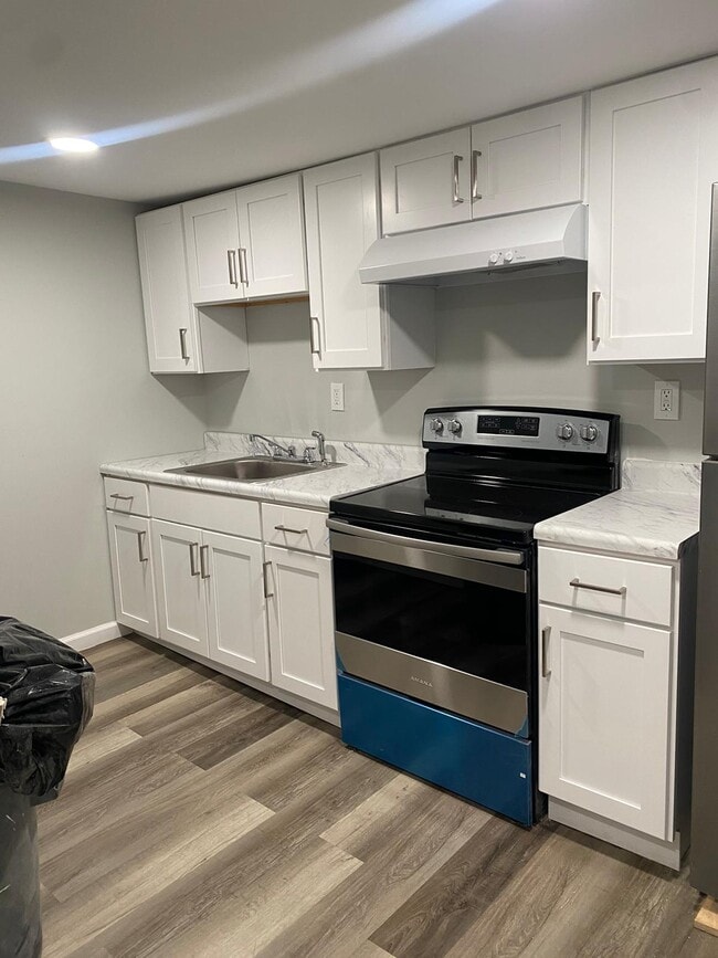 Beautiful new kitchen white shaker cabinets with stainless steel appliances - 12 Plank Rd