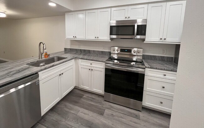 Building Photo - Two-story condominium, featuring 2 bedrooms and 2 1/2 bathrooms