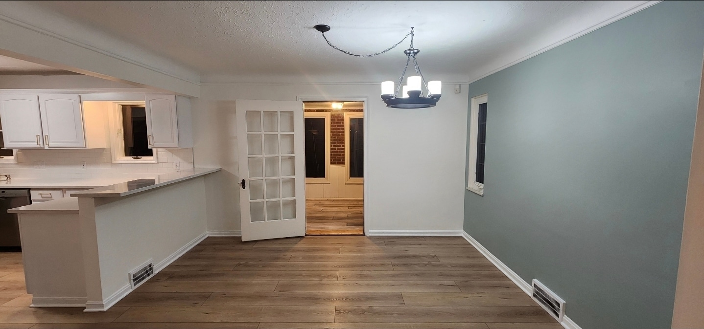 Inviting dining room with easy access to the bonus sunroom, creating a bright, open flow for meals a - 90 E 216th St