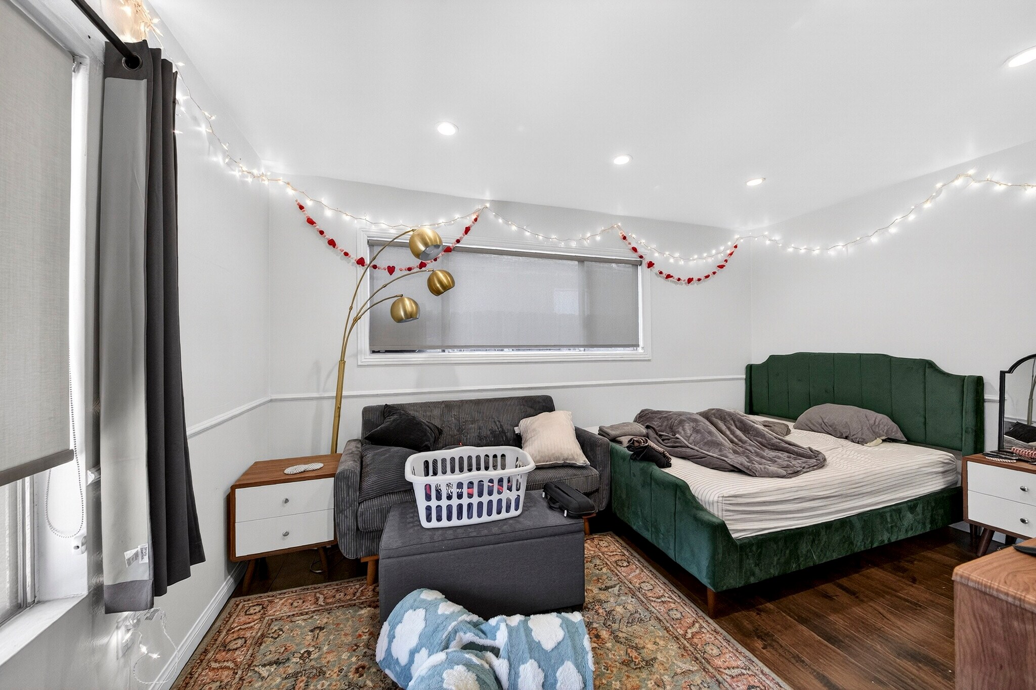 A well-proportioned corner bedroom featurs dual aspect windows facing the front and side yards. - 5214 Dawes Ave