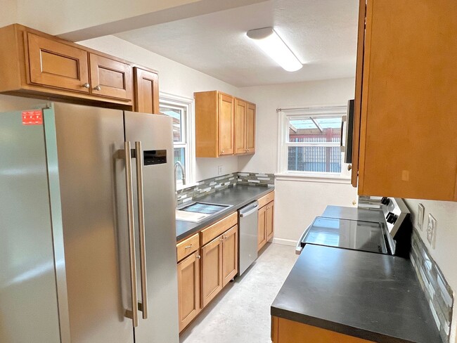 Building Photo - This beautifully updated home offers a bri...
