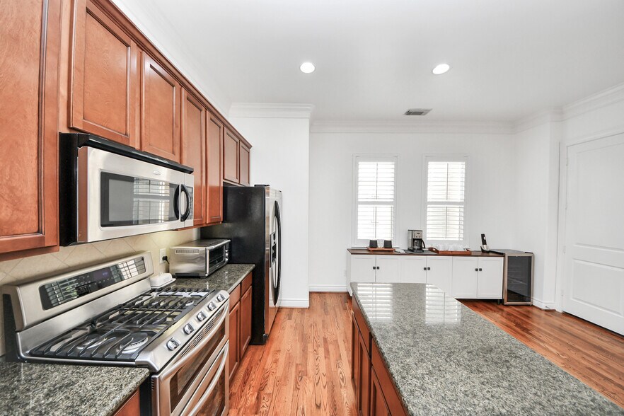 Natural light enhances the kitchen’s open and practical layout. - 620 Rutland St