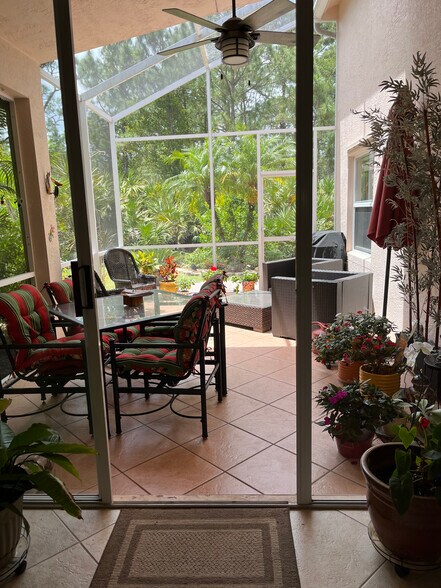 Lanai - screened in, half covered, half open, sliders from LR - 329 NW Treeline Trce