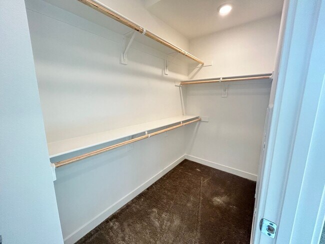 Building Photo - Gorgeous, 3 level townhome, featuring 2 car garage central Air, and in Unit laundry.