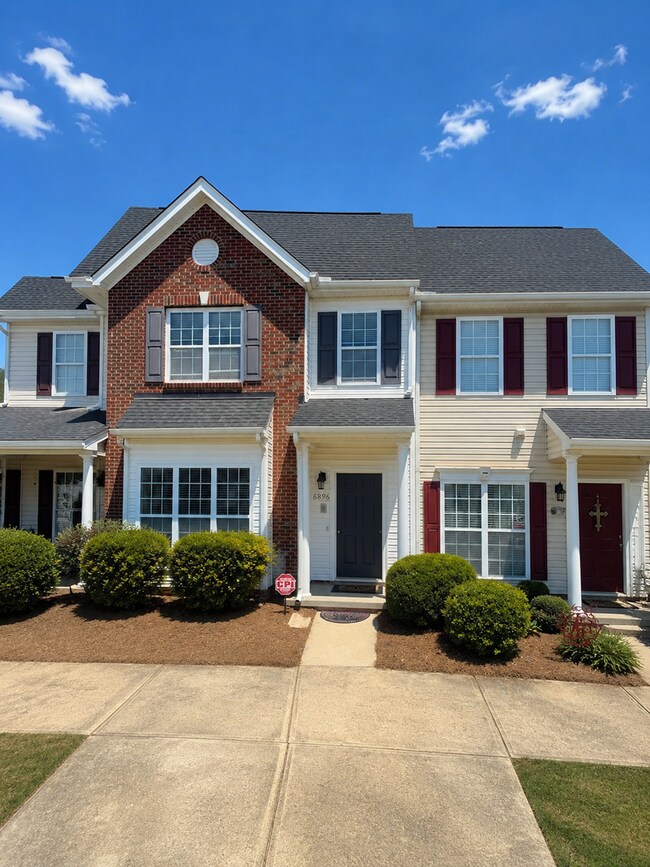 Building Photo - Beautiful 3-Bedroom Townhome with Pond View | Lawn Care Included | Convenient Whitsett Location