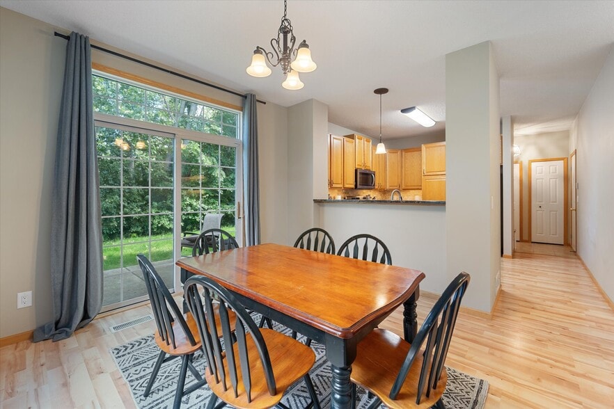 Dining room into kitchen - 9092 Merrimac Ln N