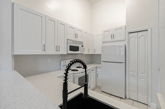 Building Photo - 2-bath condo on the 2nd floor with a newly...