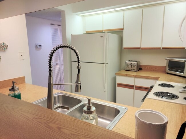 Building Photo - Bird Bay Village Annual Rental – Furnished 1st Floor Unit with Covered Parking