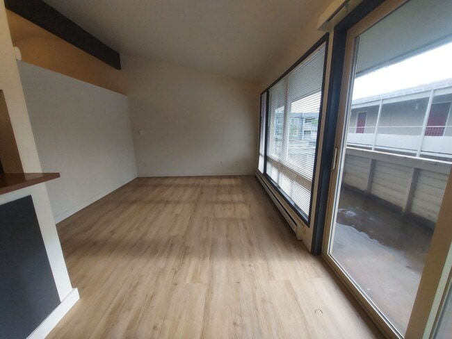 Building Photo - North Seattle 1BR with Private Balcony, Natural Light, and Modern Flooring