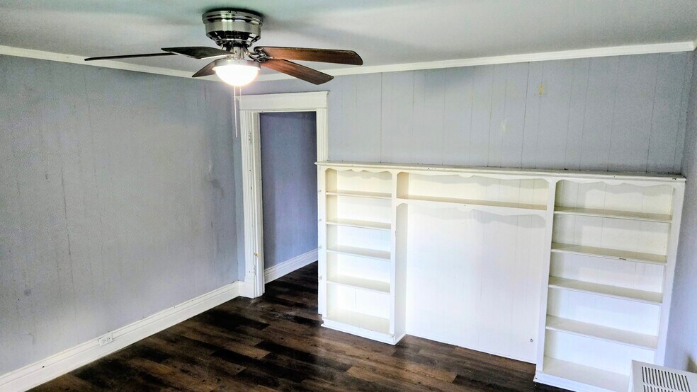 The living room has vinyl flooring and ceiling fan - 3348 Bohannon Ave